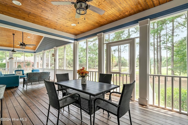 sunroom / solarium with ceiling fan, wooden ceiling, and vaulted ceiling