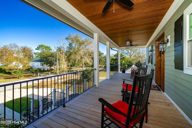 deck with covered porch and ceiling fan