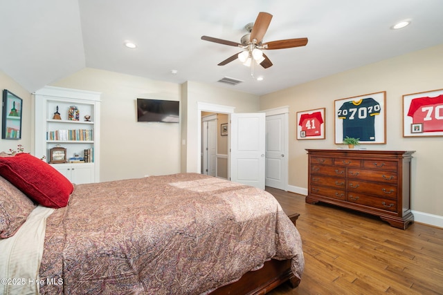 bedroom featuring visible vents, wood finished floors, baseboards, ceiling fan, and recessed lighting
