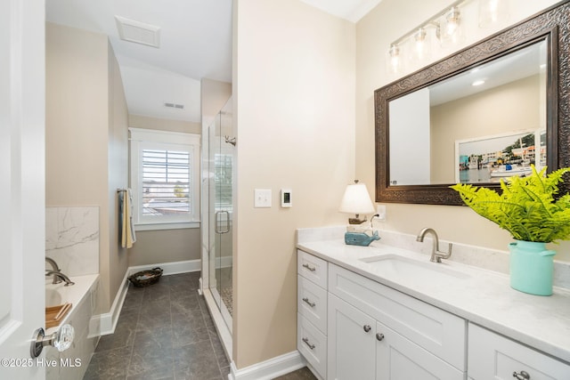 full bathroom with vanity, baseboards, visible vents, a bath, and a stall shower