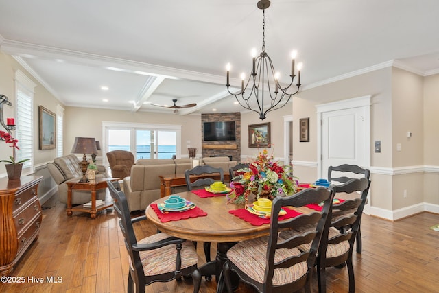 dining area featuring ornamental molding, beam ceiling, recessed lighting, and hardwood / wood-style floors
