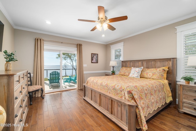 bedroom with access to outside, multiple windows, and dark wood-style floors