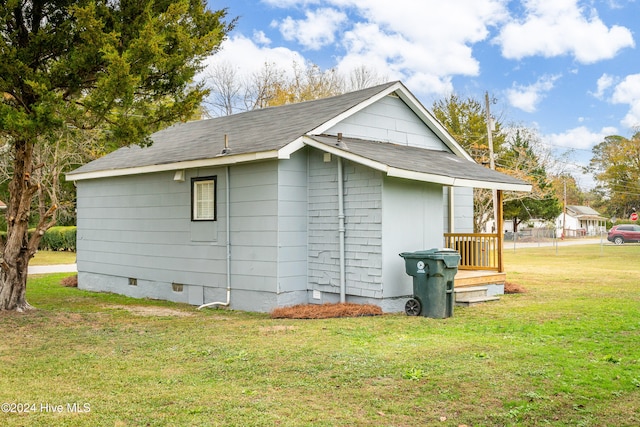 view of home's exterior with a lawn