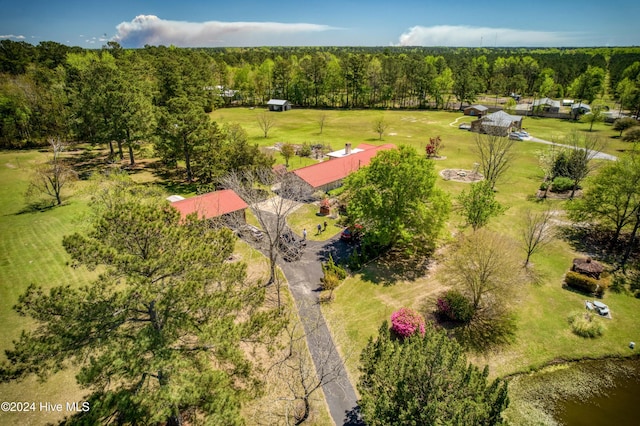 drone / aerial view with a rural view and a wooded view