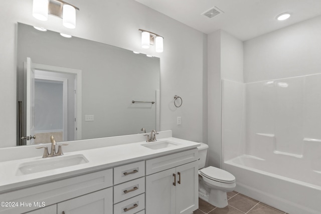 full bathroom featuring tile patterned floors, vanity, toilet, and tub / shower combination