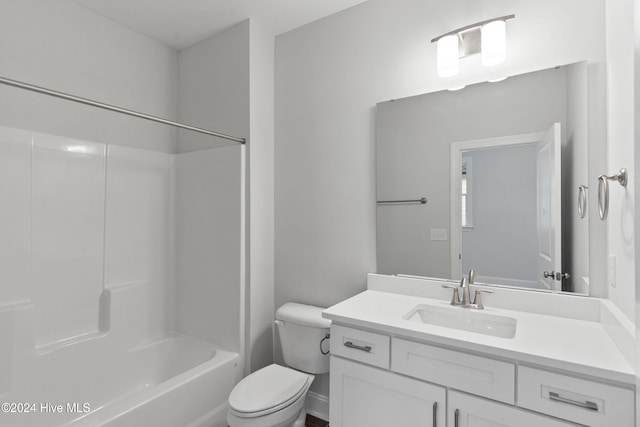 full bathroom featuring vanity, toilet, and washtub / shower combination