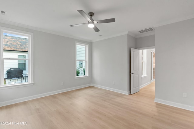 3146 Painted Turtle Loop Unit 12, Wilmington, NC 28409 - empty room featuring healthy amount of natural light, light wood-type flooring, ceiling fan, and ornamental molding