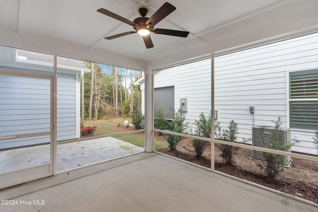 unfurnished sunroom featuring ceiling fan