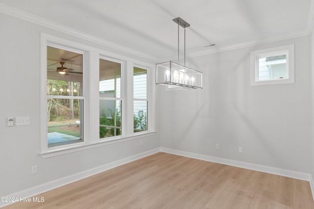 3146 Painted Turtle Loop Unit 12, Wilmington, NC 28409 - unfurnished dining area with crown molding, light wood-style flooring, baseboards, a chandelier, and a ceiling fan