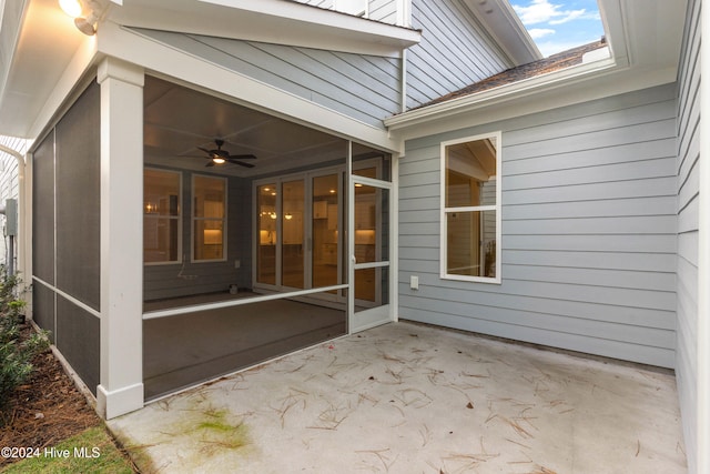 view of patio / terrace featuring a sunroom