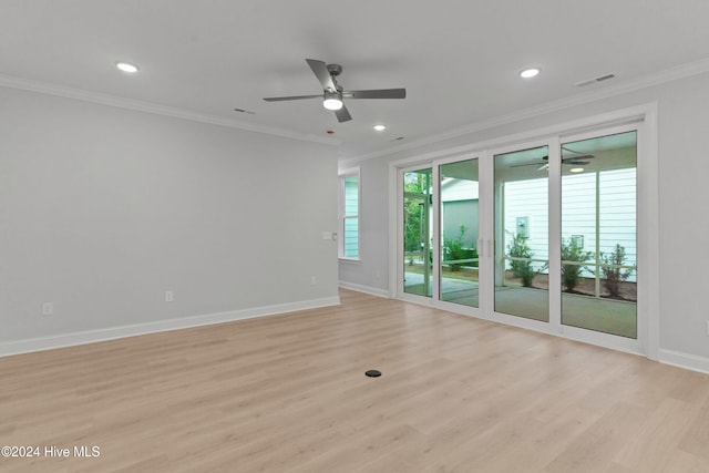 spare room featuring ceiling fan, light wood-type flooring, and crown molding