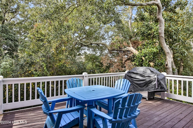 221 Seawatch Way, Kure Beach, NC 28449 - wooden deck with outdoor dining space and grilling area