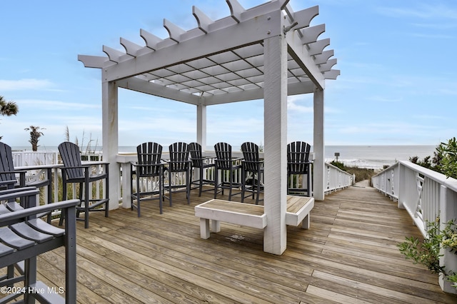 221 Seawatch Way, Kure Beach, NC 28449 - wooden deck with a pergola and a water view