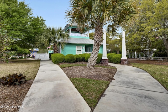 221 Seawatch Way, Kure Beach, NC 28449 - view of front of property with a gate and metal roof