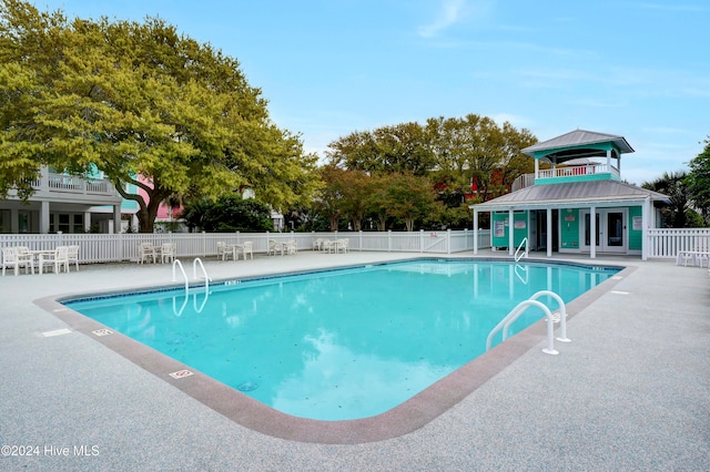 view of swimming pool featuring a patio