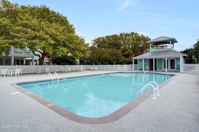 221 Seawatch Way, Kure Beach, NC 28449 - community pool featuring a patio