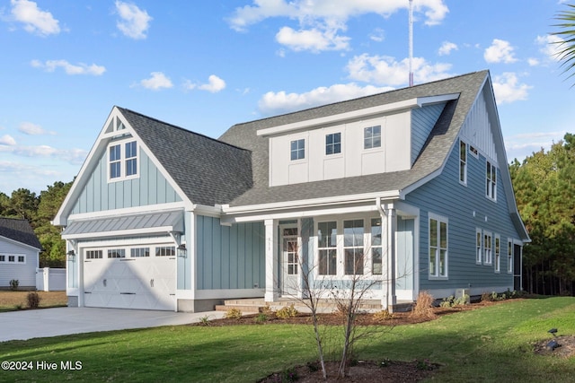 view of front of home with a garage and a front lawn