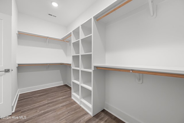513 Moss Lake Ln, Holly Ridge, NC 28445 - walk in closet with visible vents and wood finished floors