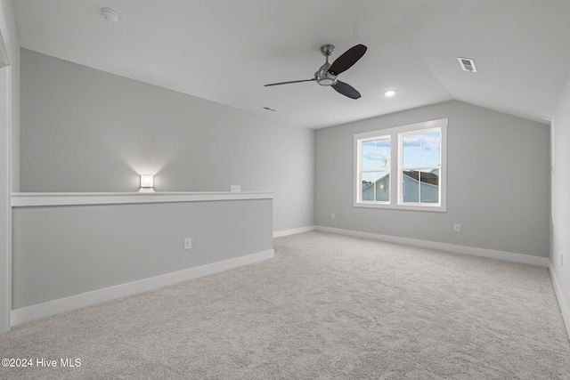513 Moss Lake Ln, Holly Ridge, NC 28445 - carpeted spare room featuring ceiling fan, visible vents, baseboards, and lofted ceiling