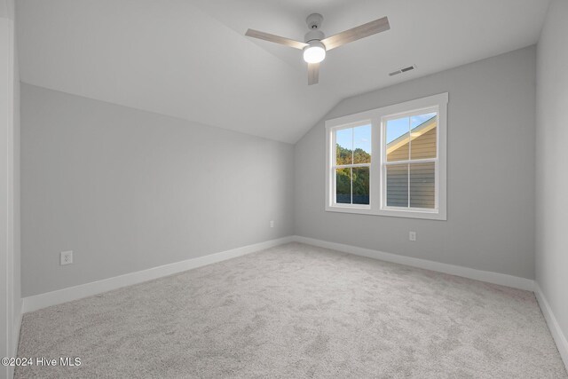 513 Moss Lake Ln, Holly Ridge, NC 28445 - bonus room with carpet floors, visible vents, baseboards, ceiling fan, and vaulted ceiling