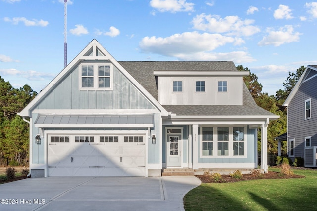 513 Moss Lake Ln, Holly Ridge, NC 28445 - view of front of home featuring a shingled roof, a front lawn, board and batten siding, and concrete driveway