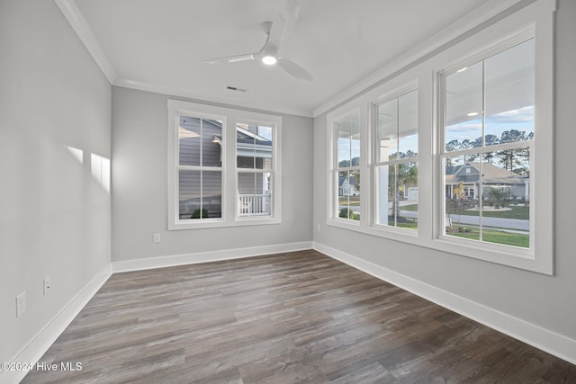 513 Moss Lake Ln, Holly Ridge, NC 28445 - empty room featuring crown molding, baseboards, and a healthy amount of sunlight