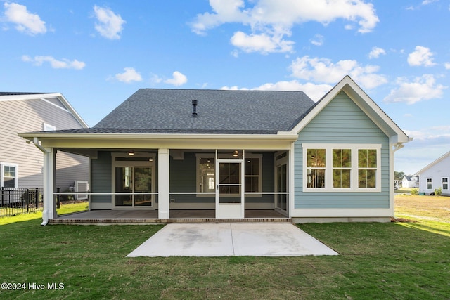 513 Moss Lake Ln, Holly Ridge, NC 28445 - back of house featuring ceiling fan, fence, a shingled roof, a patio area, and a lawn