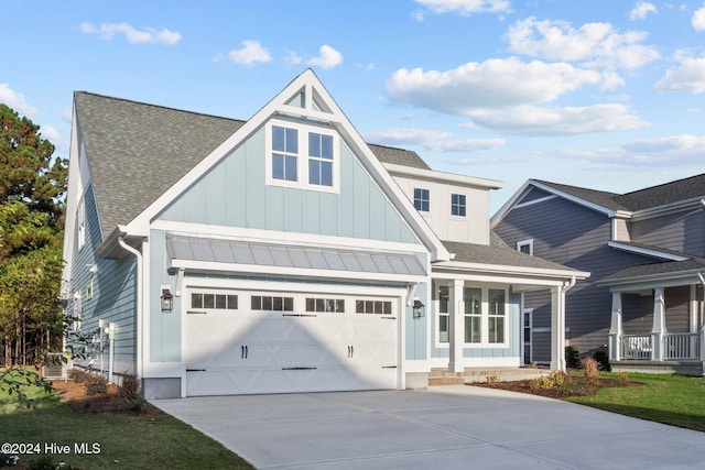513 Moss Lake Ln, Holly Ridge, NC 28445 - craftsman-style house featuring board and batten siding, a standing seam roof, driveway, and a shingled roof