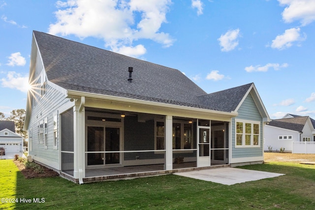 513 Moss Lake Ln, Holly Ridge, NC 28445 - rear view of property with a sunroom, fence, a yard, a patio, and a shingled roof