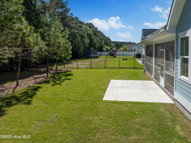 513 Moss Lake Ln, Holly Ridge, NC 28445 - view of yard featuring fence, a playground, a patio, and a sunroom