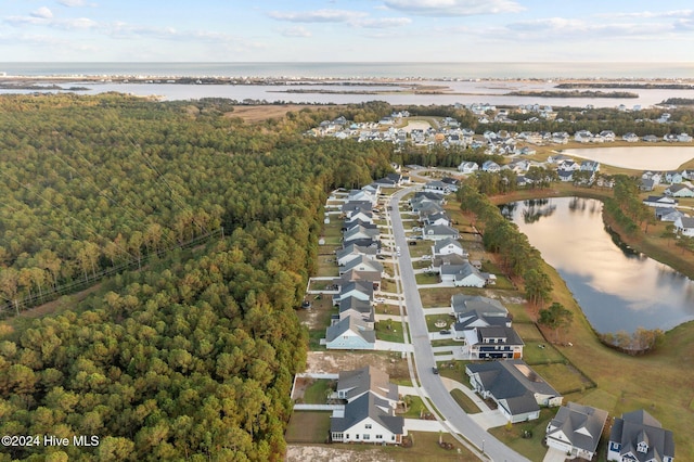 513 Moss Lake Ln, Holly Ridge, NC 28445 - bird's eye view featuring a water view, a residential view, and a forest view