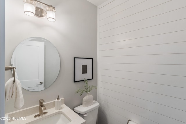 513 Moss Lake Ln, Holly Ridge, NC 28445 - half bath with toilet, a chandelier, and a sink