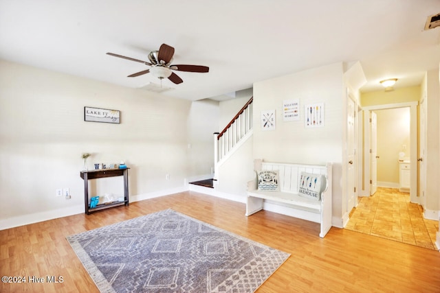 foyer entrance featuring hardwood / wood-style flooring and ceiling fan