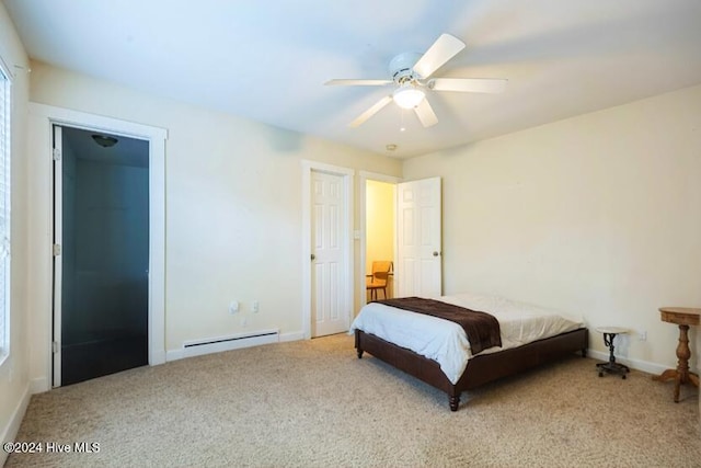 carpeted bedroom featuring ceiling fan and baseboard heating