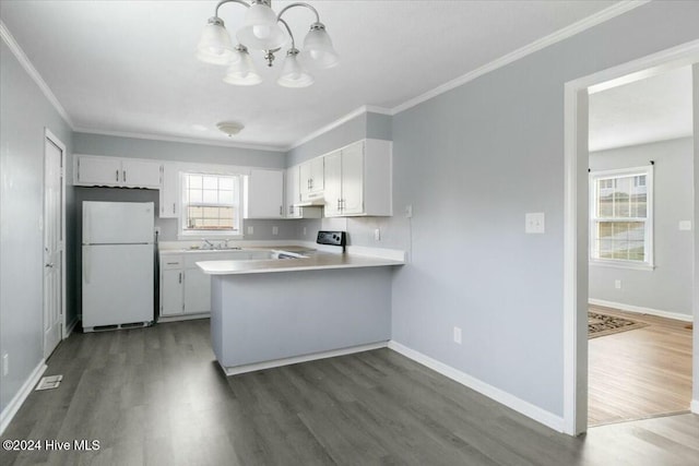 kitchen featuring dark hardwood / wood-style flooring, electric stove, white fridge, white cabinetry, and hanging light fixtures