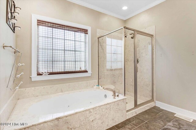 bathroom featuring plus walk in shower and ornamental molding