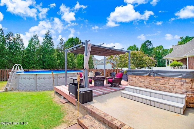 view of patio featuring a pergola and a fenced in pool