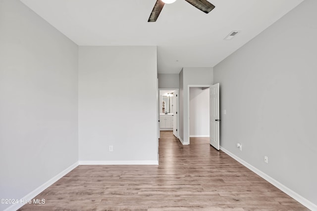 unfurnished room with ceiling fan and light hardwood / wood-style floors