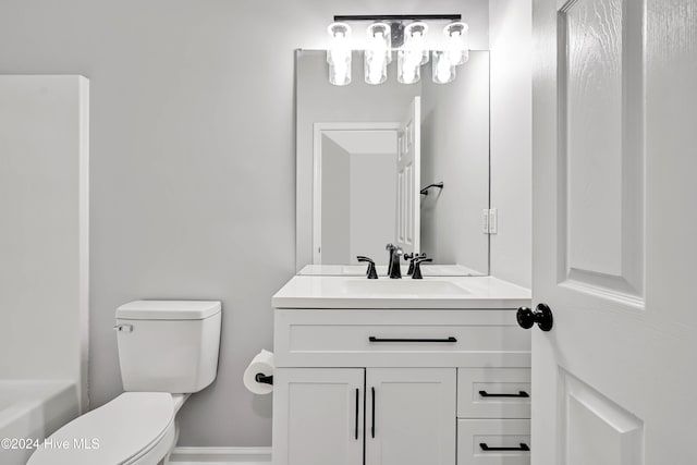 bathroom with vanity and toilet