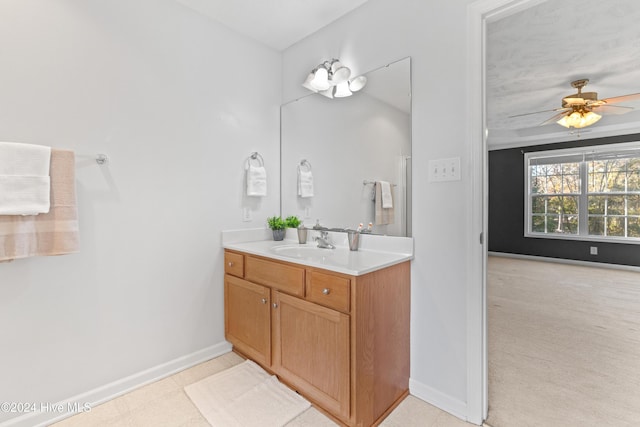 bathroom featuring ceiling fan and vanity