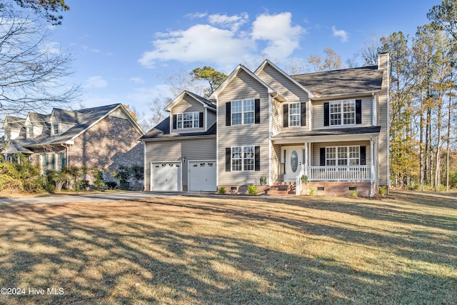 view of front facade featuring covered porch, a garage, and a front yard