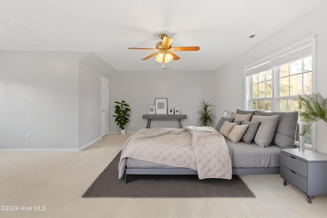 bedroom featuring light colored carpet and ceiling fan