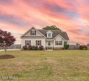 view of front of home with a yard