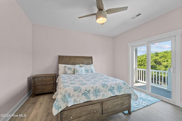 bedroom featuring light wood-type flooring, access to outside, and ceiling fan