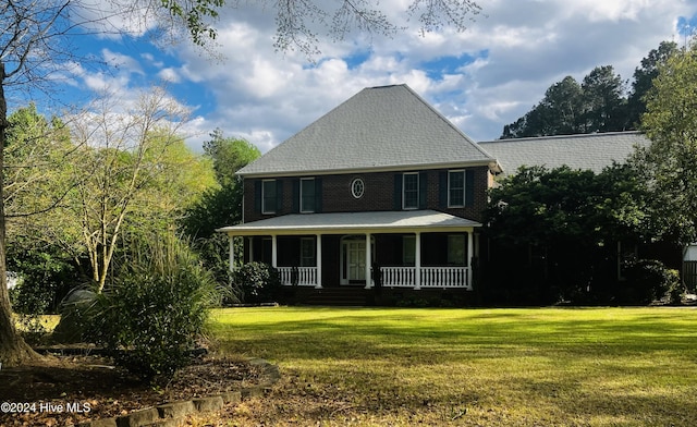 view of front of house featuring a front lawn and a porch