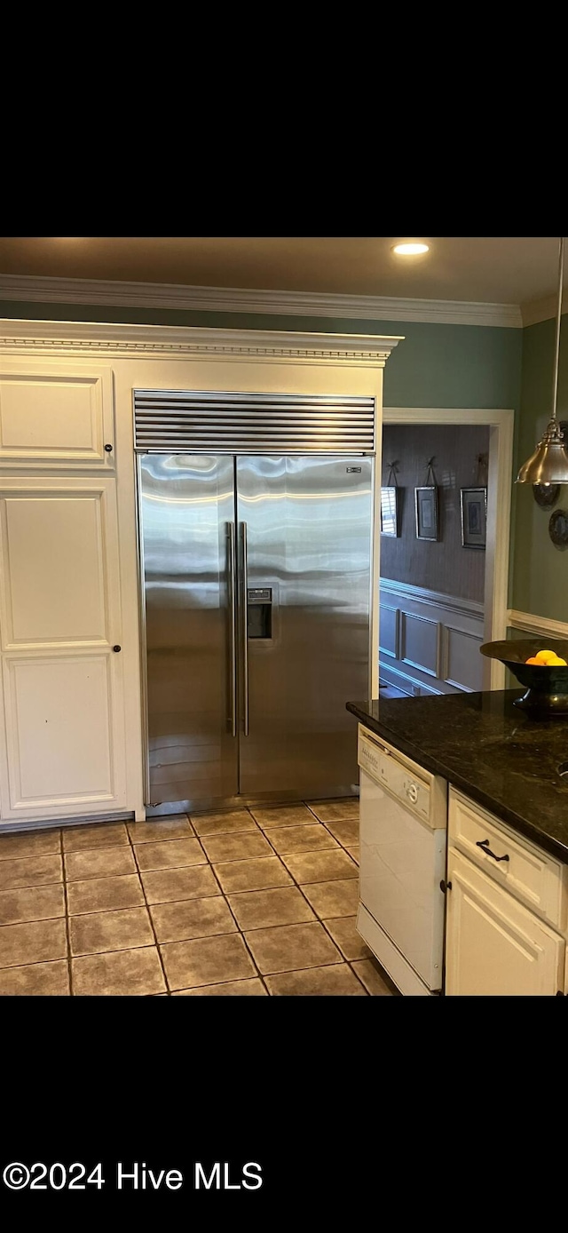 kitchen featuring ornamental molding, light tile patterned flooring, white dishwasher, and stainless steel built in refrigerator