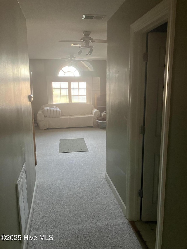 hall with carpet flooring