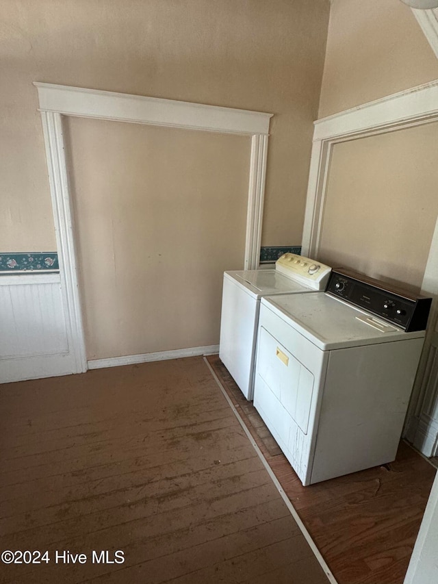 laundry room featuring washer and clothes dryer and dark wood-type flooring