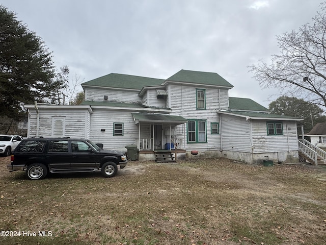620 W Main St, Williamston, NC 27892 - rear view of property featuring a shingled roof