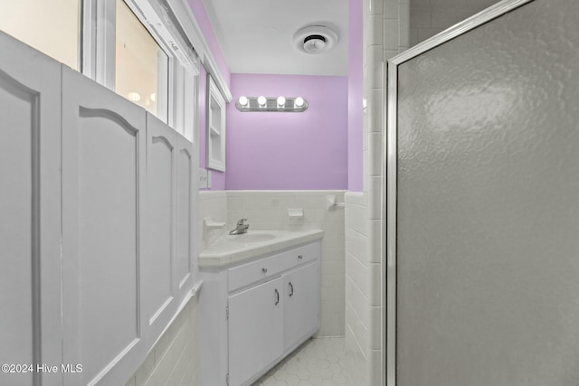 bathroom with vanity and walk in shower